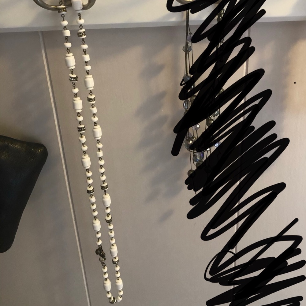 Long white beaded necklace